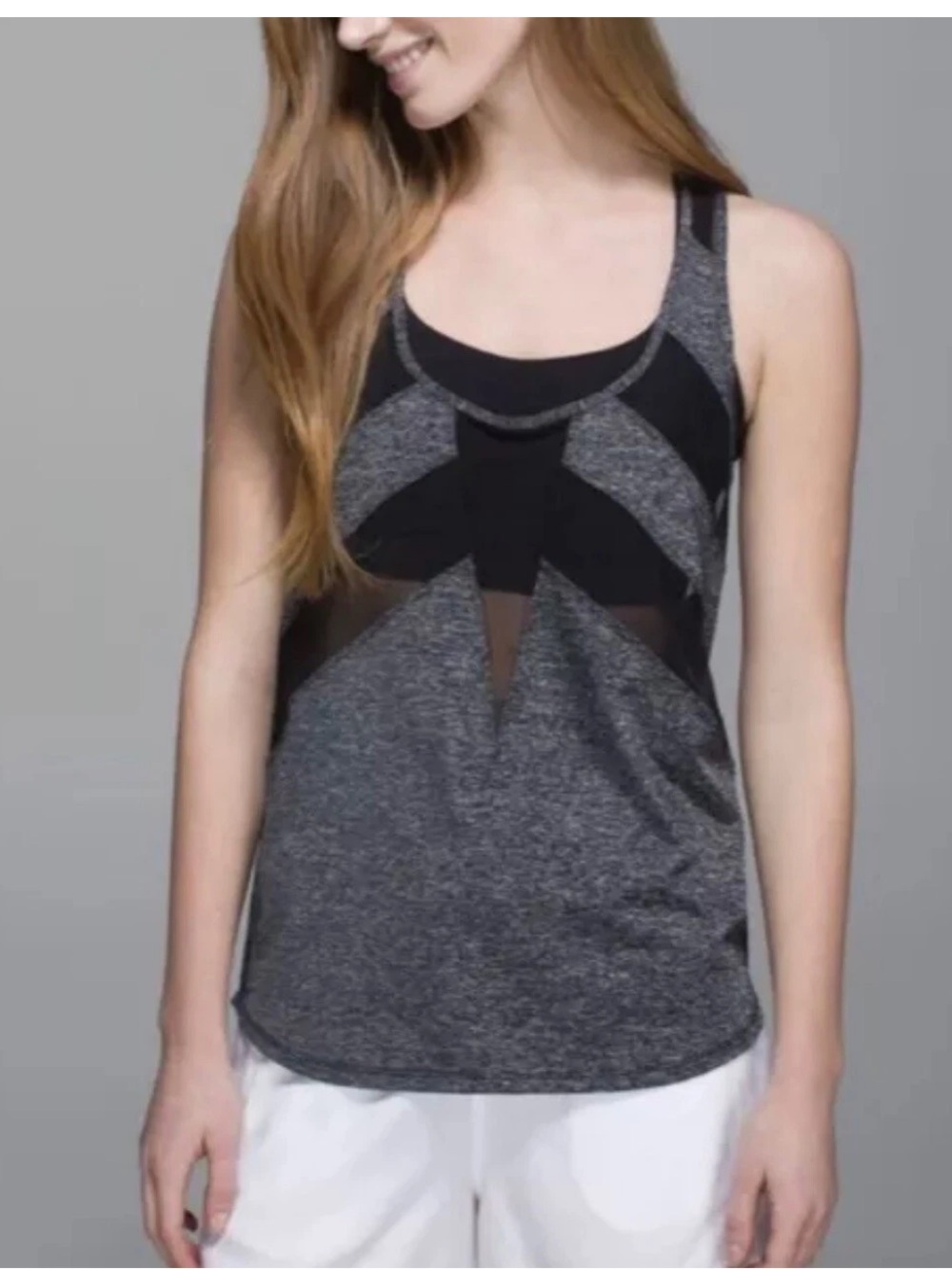 Lululemon If You're Lucky tank in a heathered gray color with black mesh